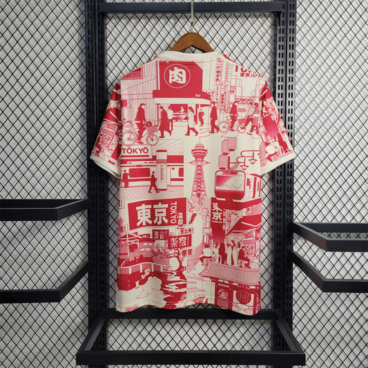 Red and white patterned shirt on a hanger against a black metal grid background